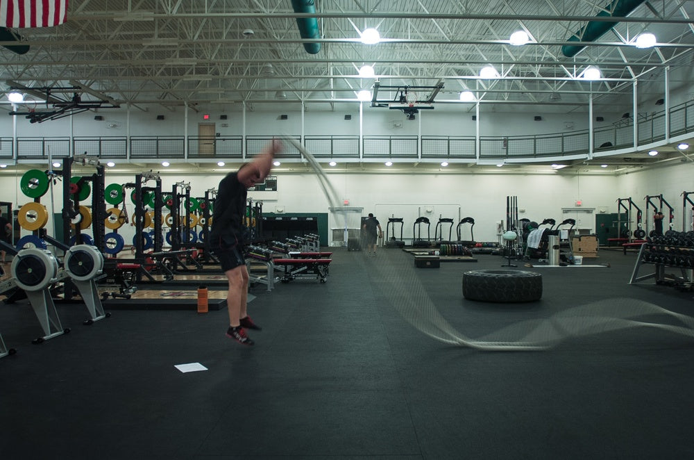 Special Forces soldier training explosive strength with battle ropes