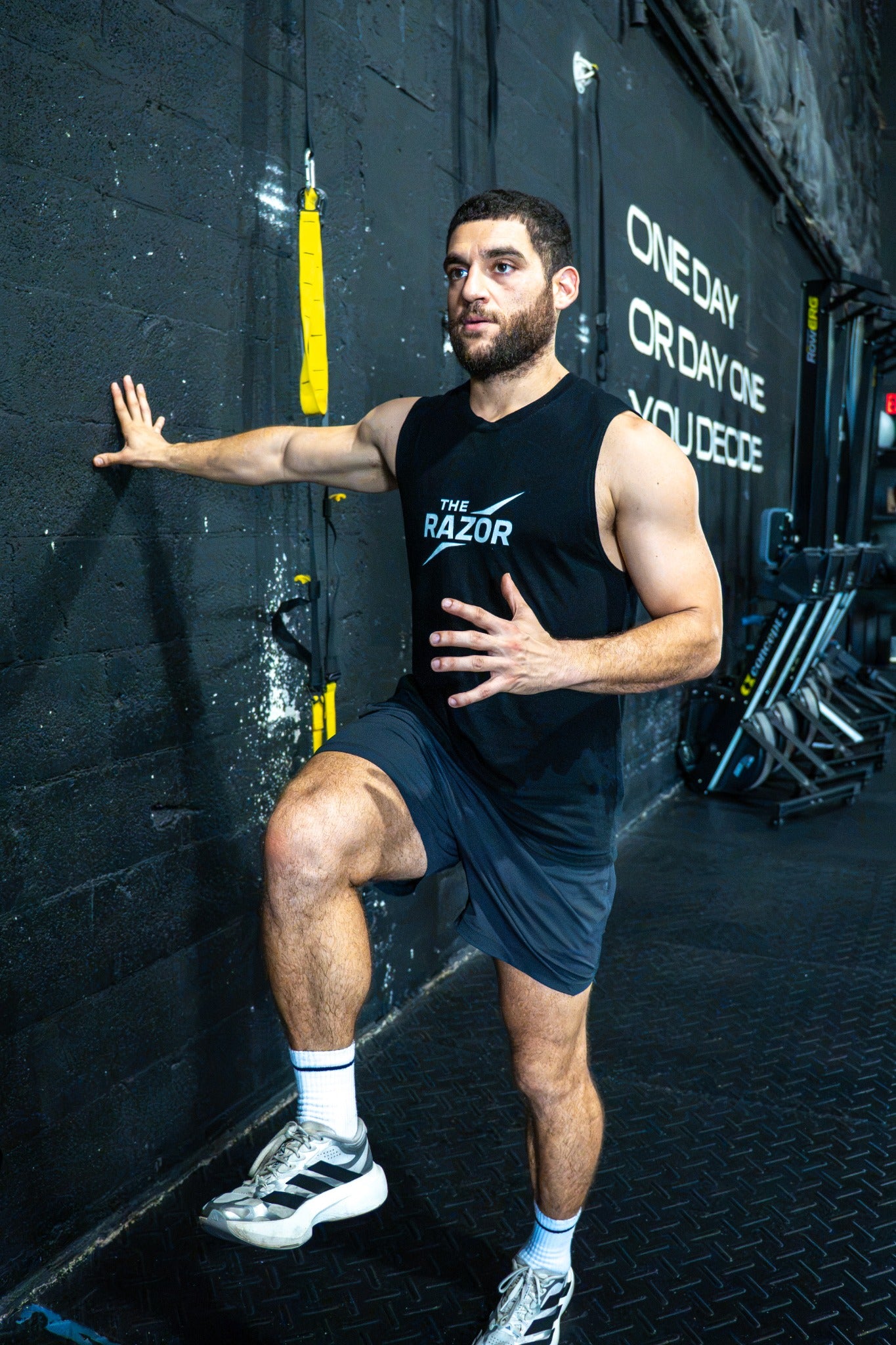 Athlete performing a movement drill in The Razor muscle tank